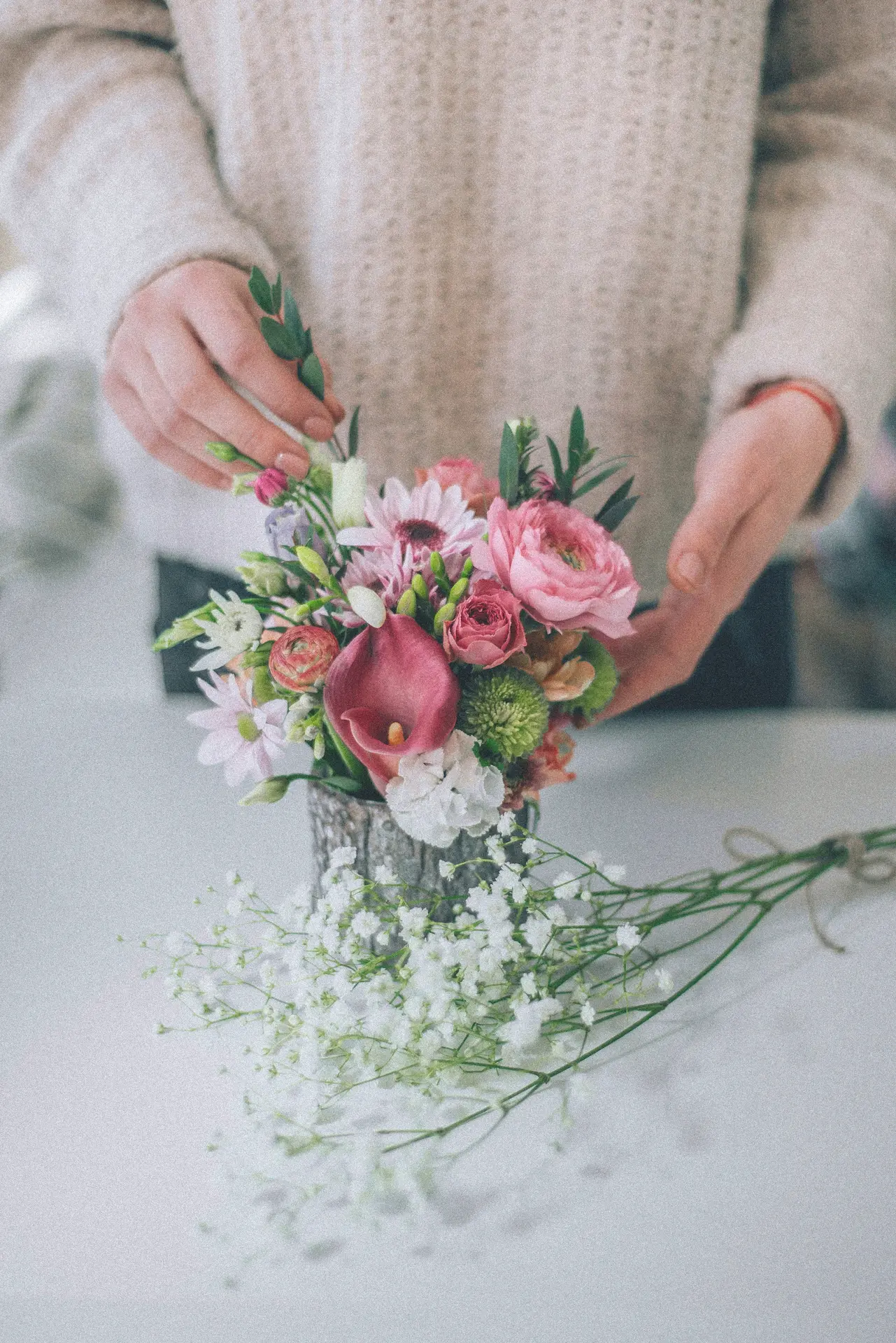woman crafting a flower bouquet