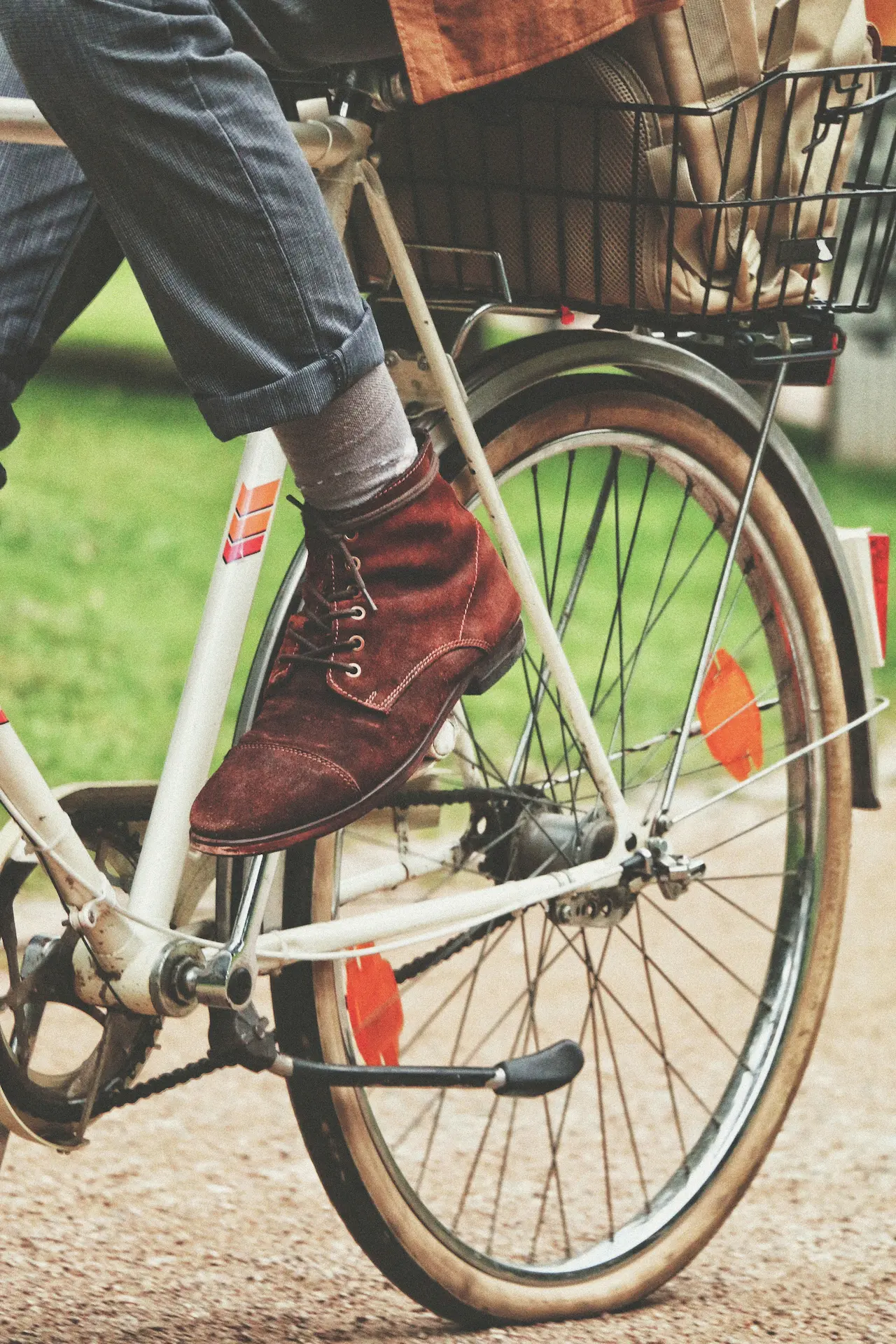close up of a man riding a bicycle focusing on his shoe style